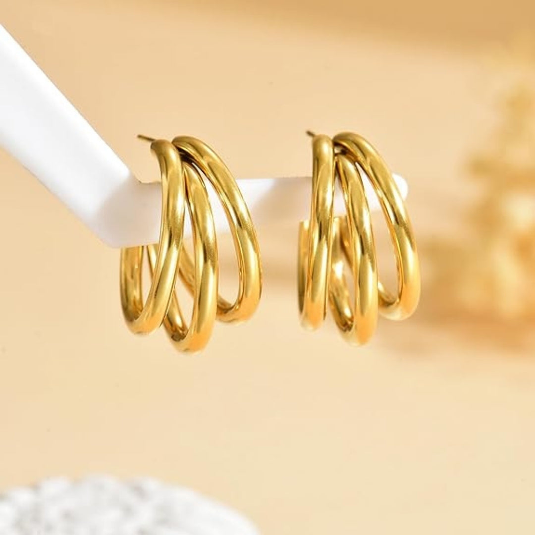 Elegant triple gold hoop earrings for everyday and party wear.