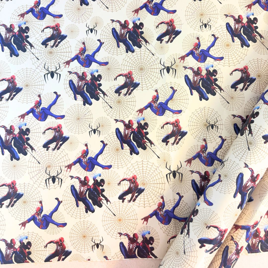 Spider-Man packing paper roll with superhero design.
