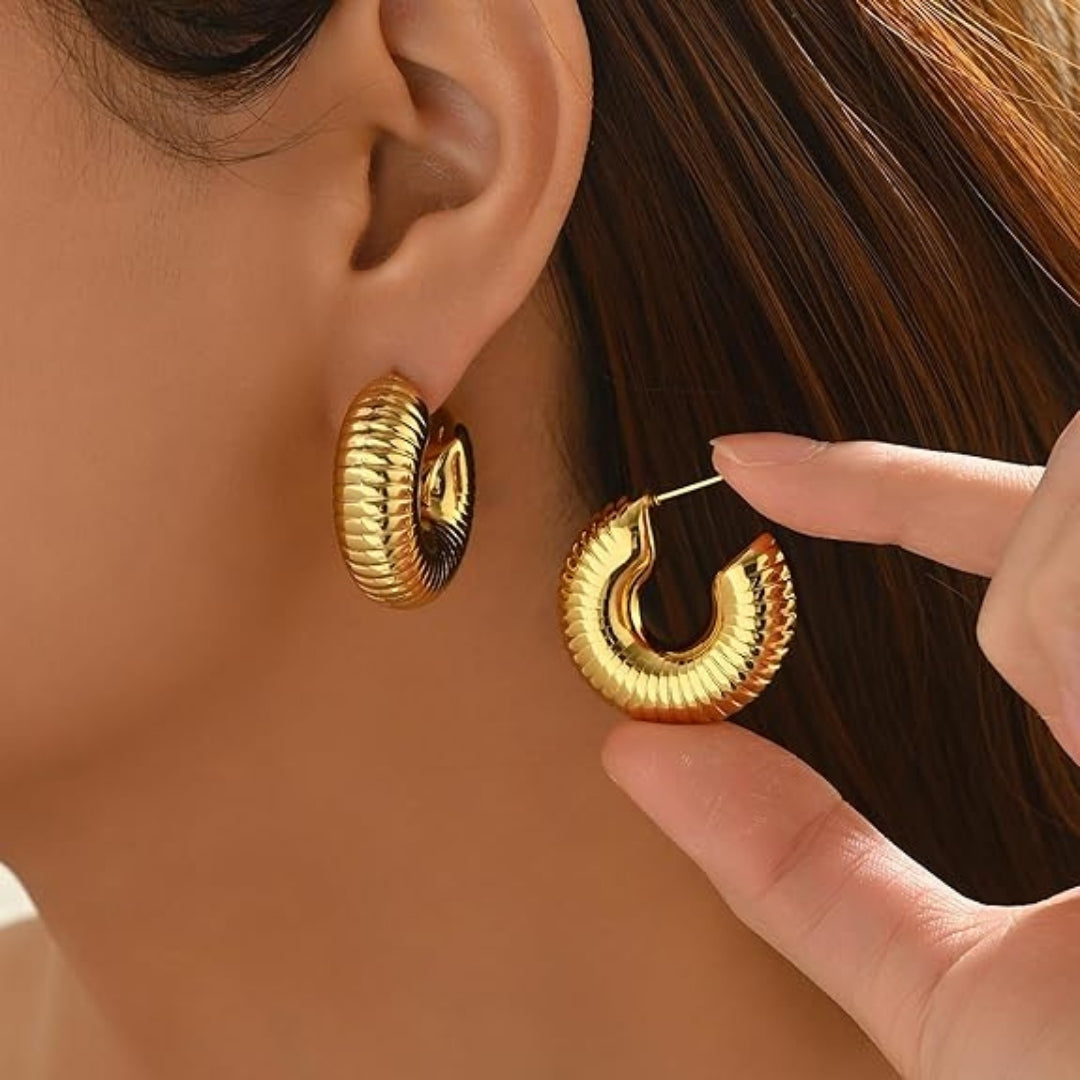 Elegant ribbed hoop earrings jewelry shot.