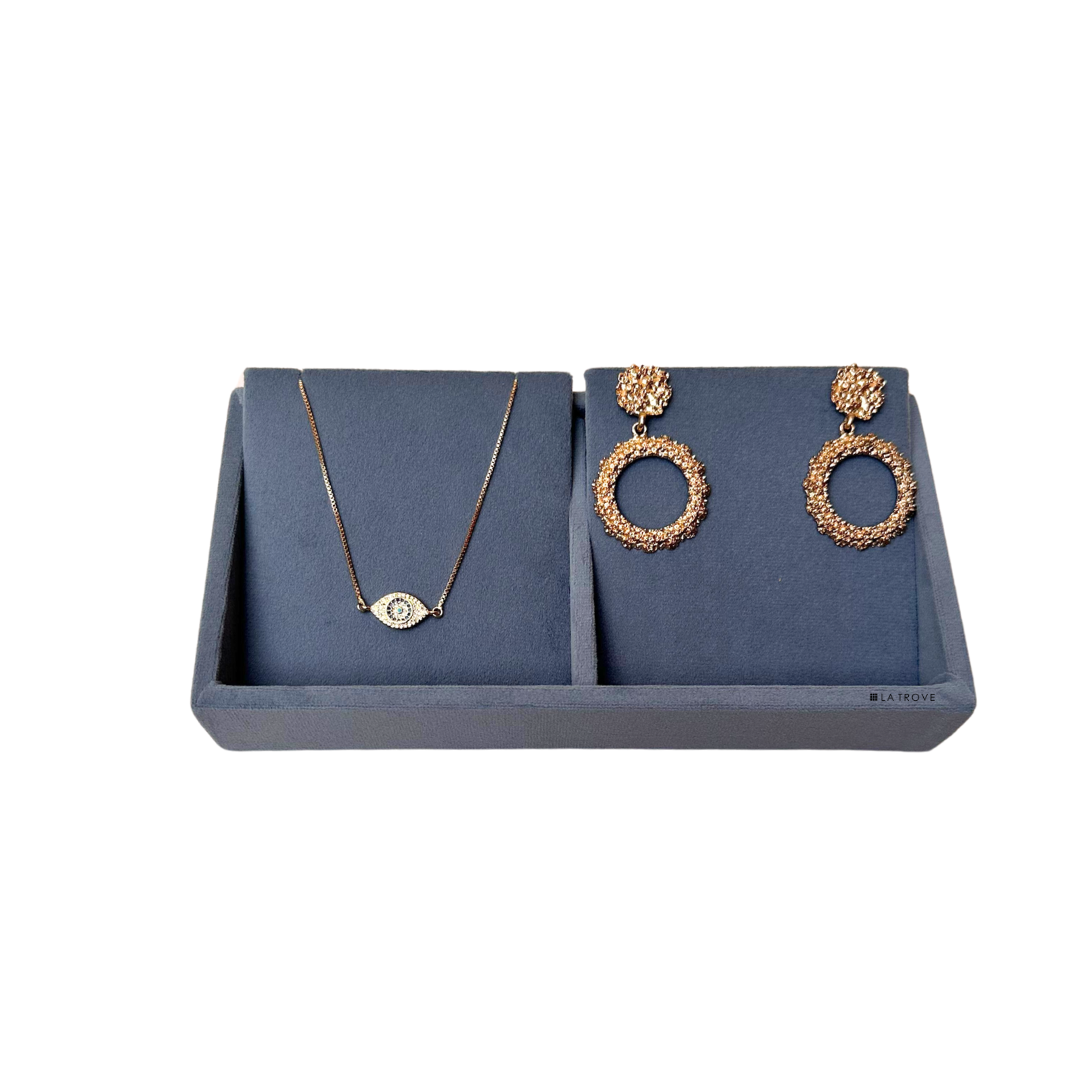 Grey velvet 2-compartment necklace tray for tangle-free chain storage.