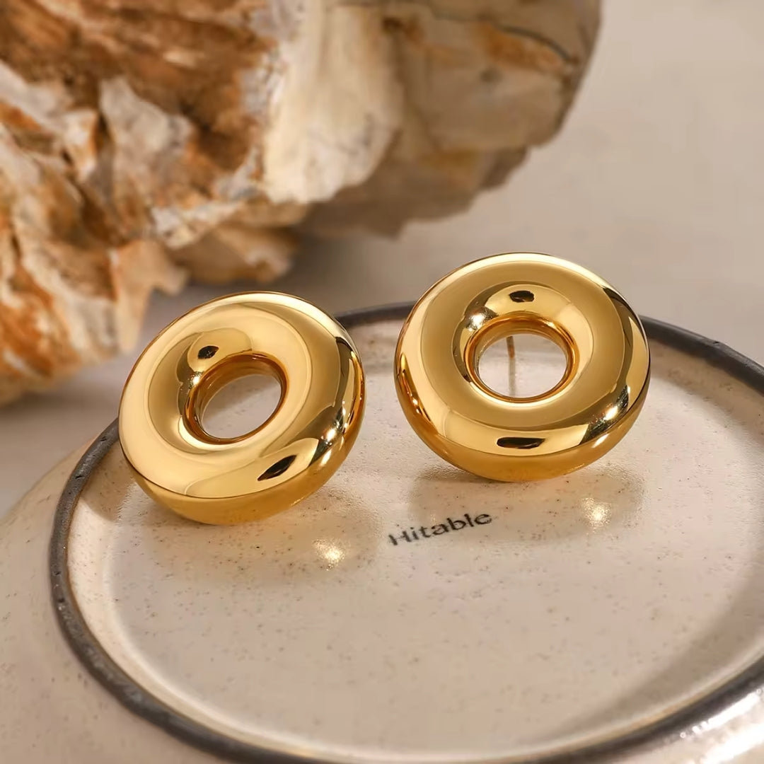 Golden metal button stud earrings for women.