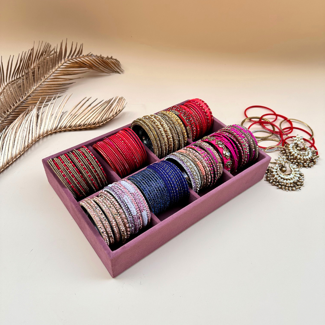 Grey velvet bangle organiser tray with multiple cushioned sections