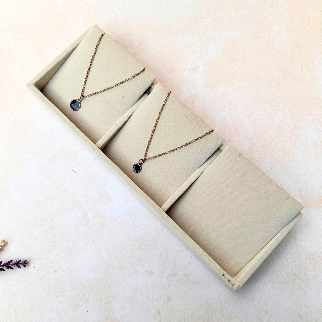 Elegant cream velvet necklace organizer with 3 anti-tangle slots
