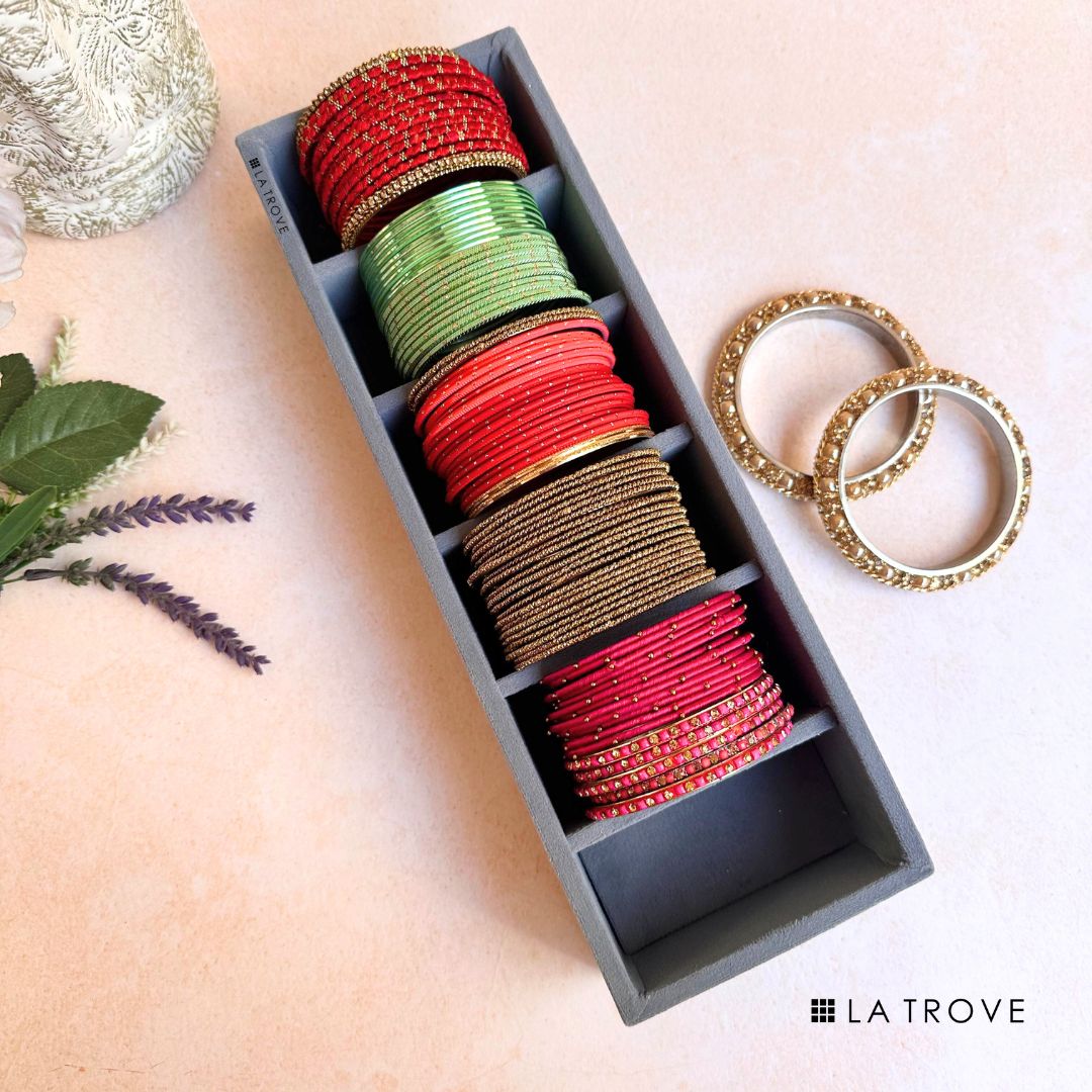 Grey velvet bangle tray organiser with 6 cushioned slots for large bangles.