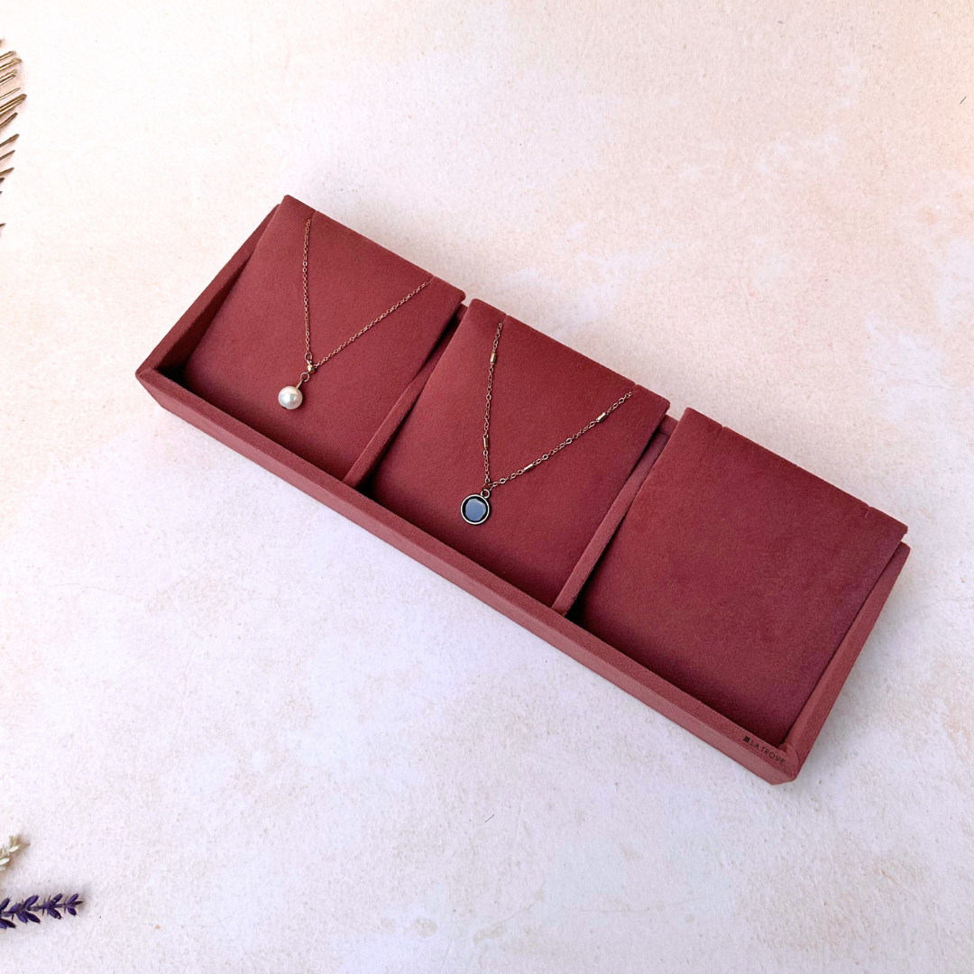 Dark pink velvet necklace tray with 3 separated sections for jewelry