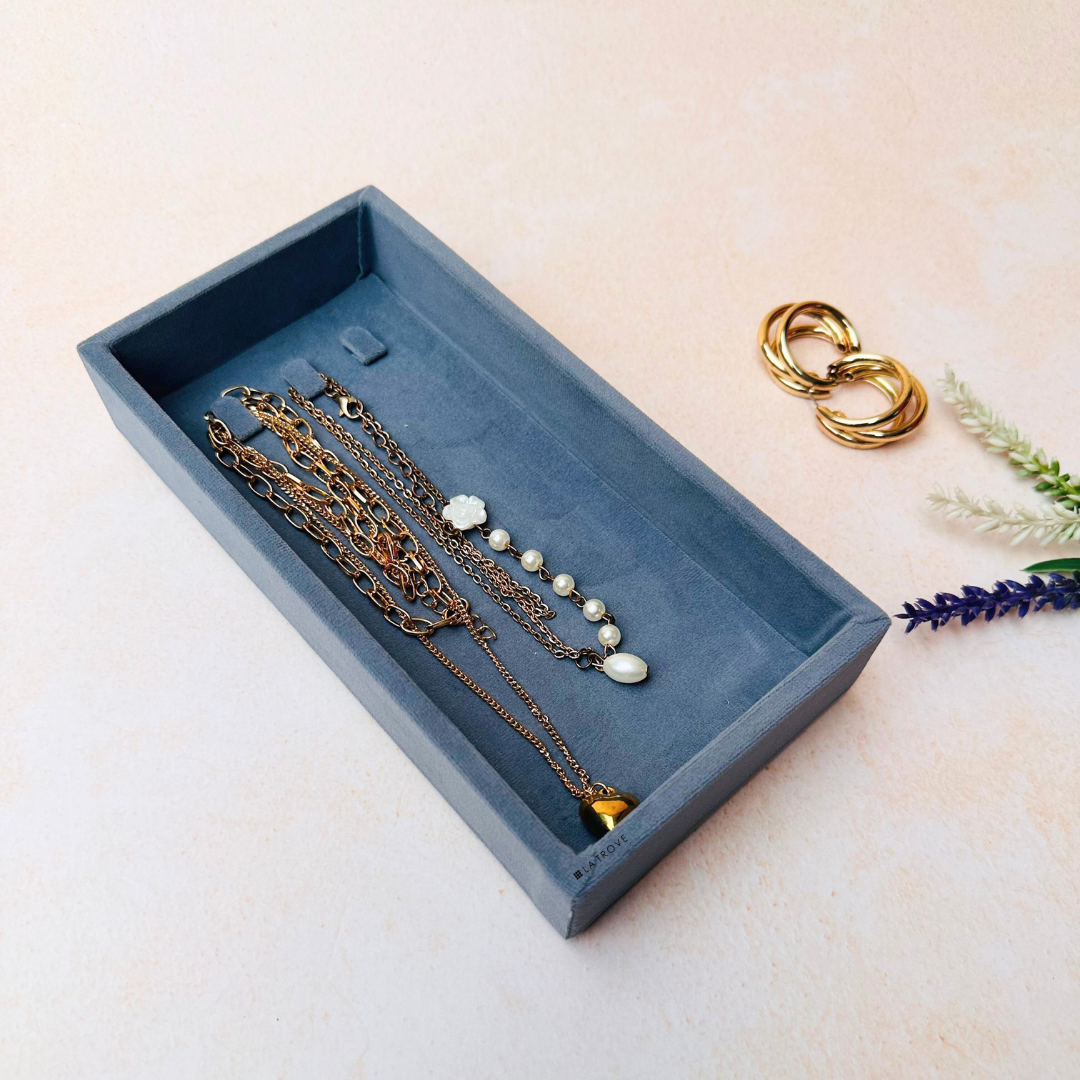 Grey velvet necklace organiser tray with three soft velvet compartments.