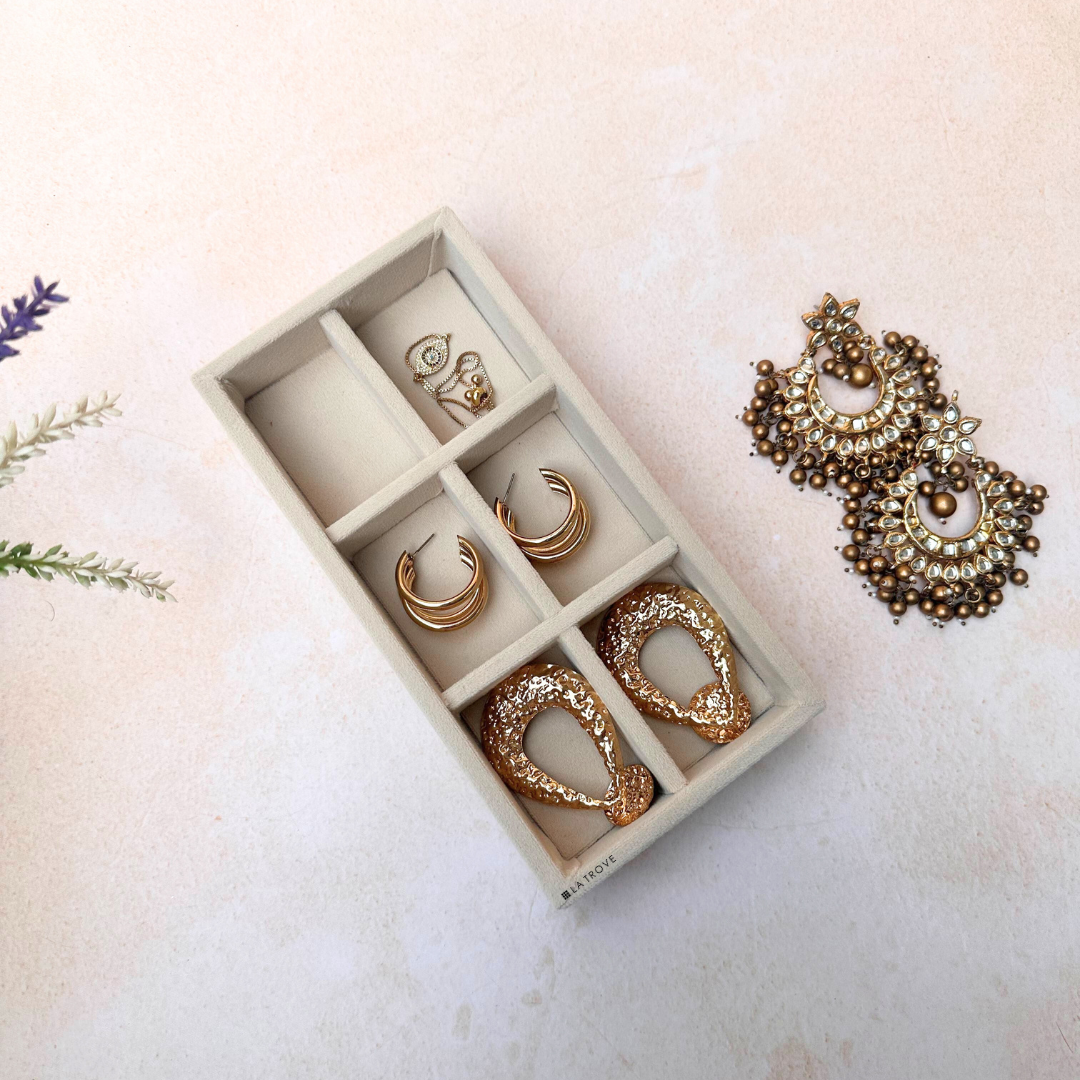 Cream velvet 6 grid jewellery organiser tray with removable dividers.