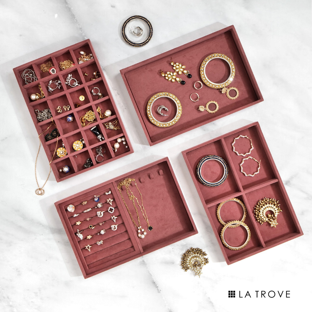 Dark pink set of 4 jewellery trays with multiple compartments for organized accessory storage.