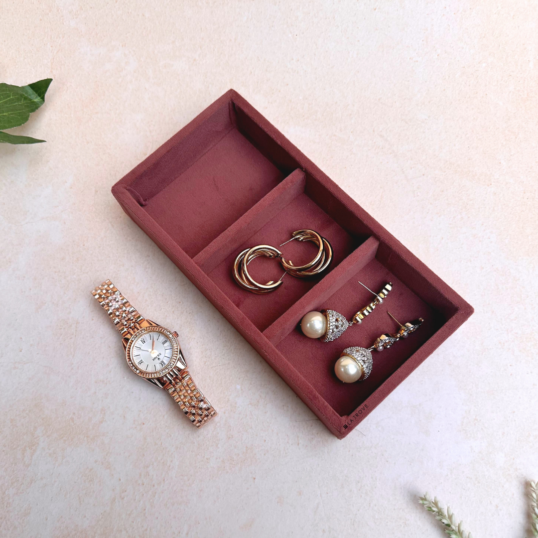 Dark pink jewellery tray with 3 velvet-lined grids for accessories.