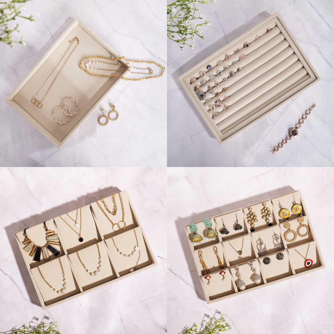 Set of 4 cream velvet jewellery trays for displaying rings, earrings, necklaces, and bangles in assorted compartments.