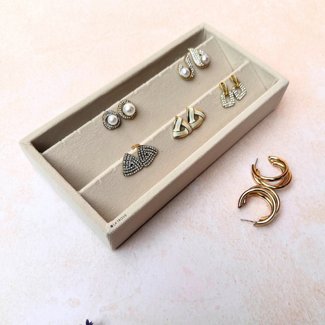 Cream velvet earring jewellery tray for organizing studs, hoops, and danglers.