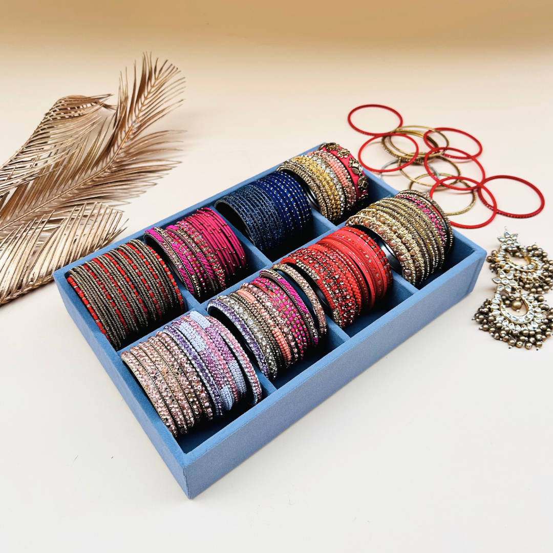 Grey velvet bangle organiser tray with multiple cushioned sections