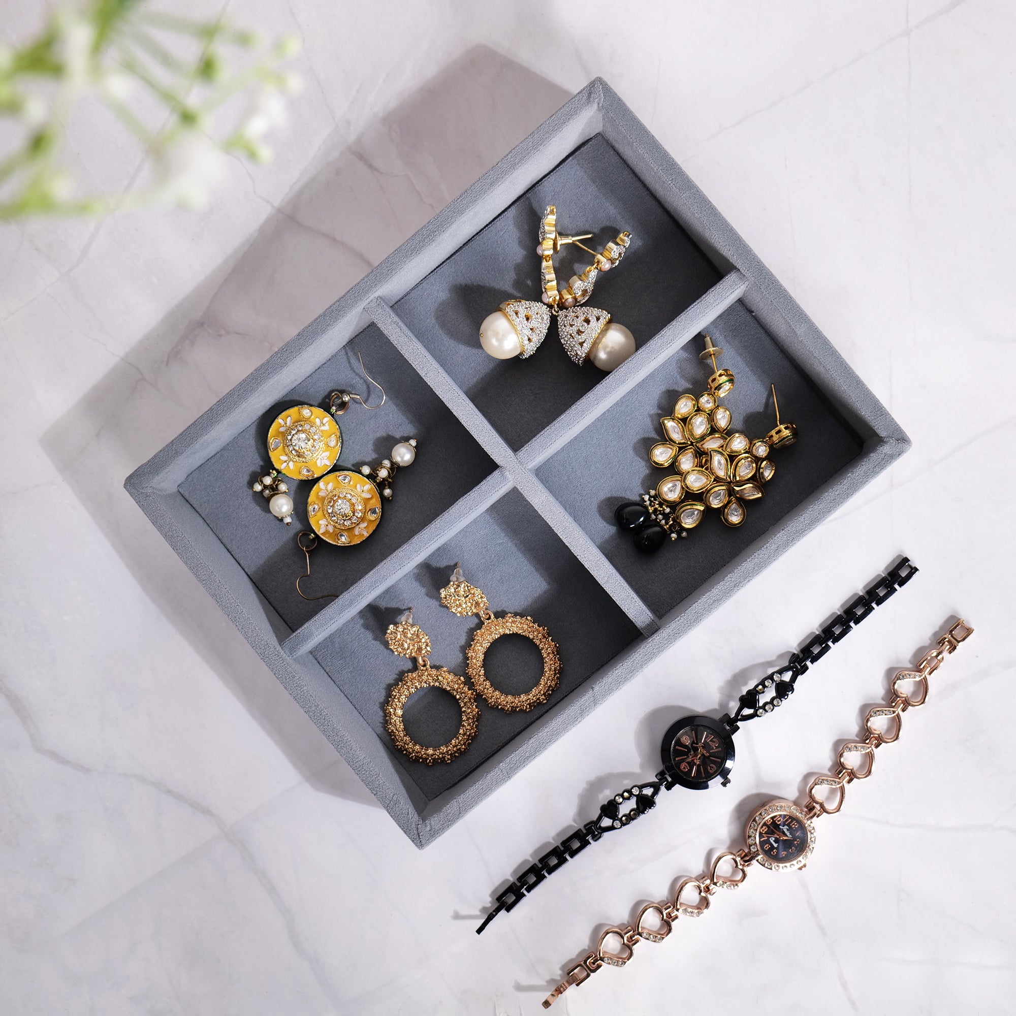 Grey velvet 4-slot jewellery organizer tray for small items.