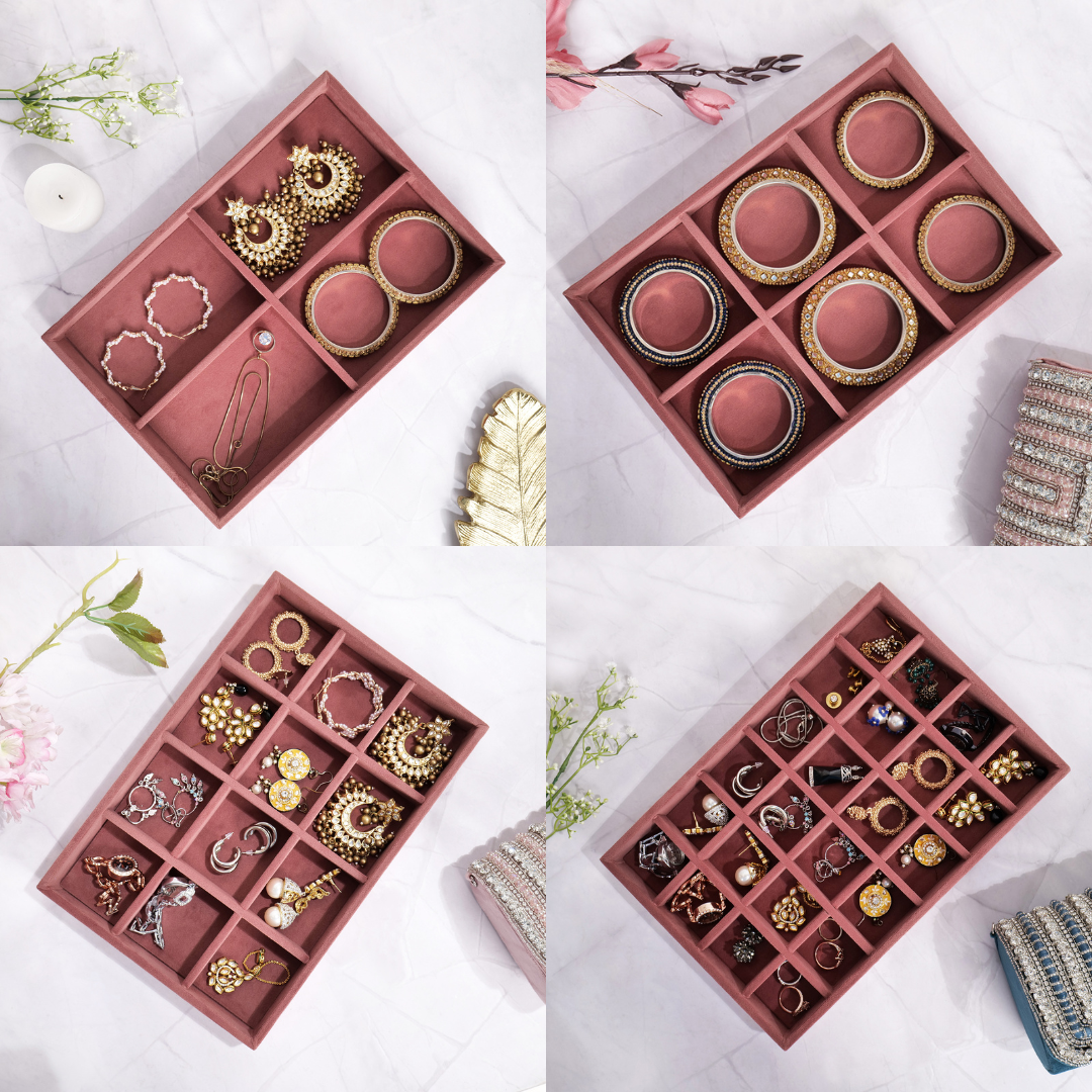 Dark pink jewellery trays with multiple grids for organized accessory storage.