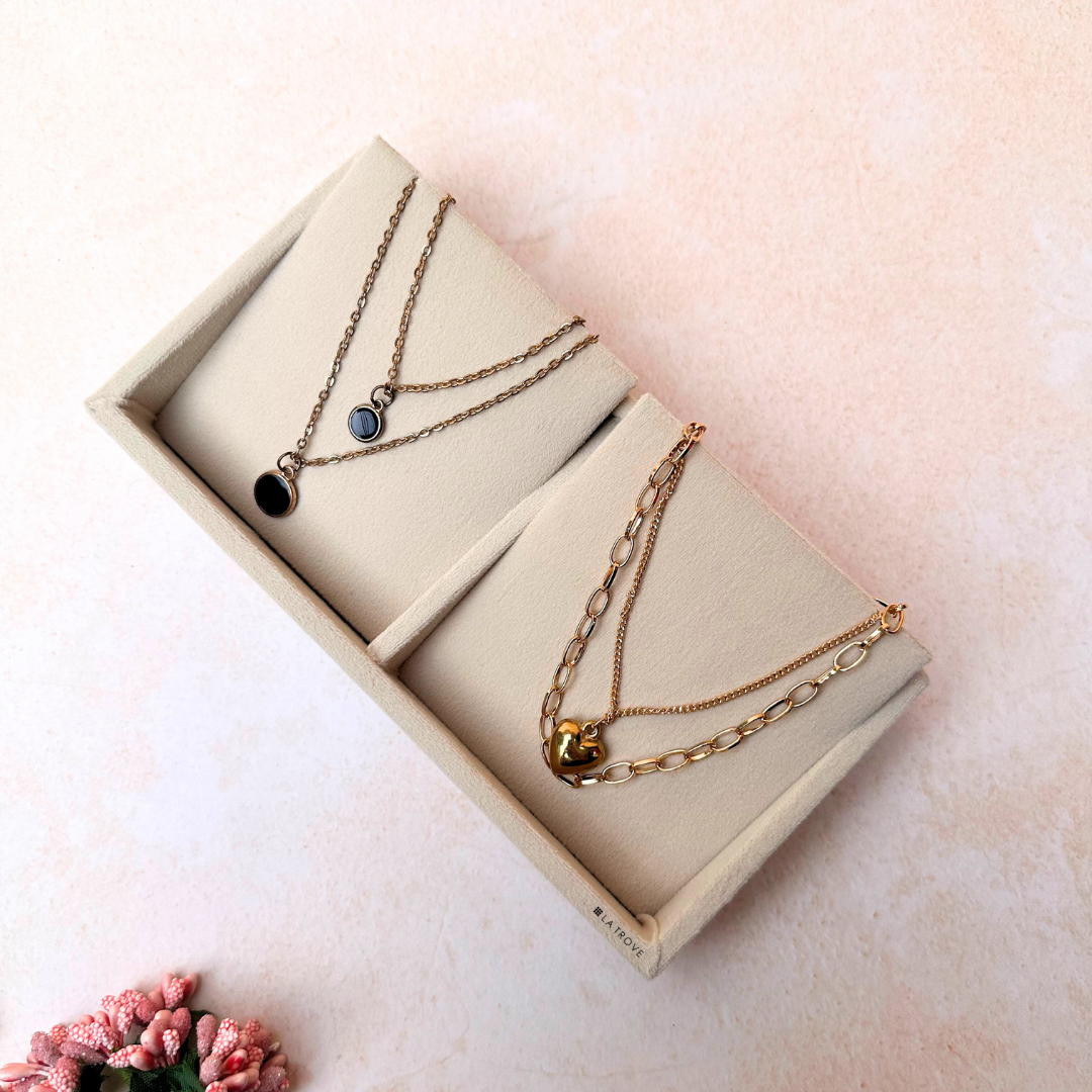 Cream velvet 2-slot necklace organiser tray with padded inserts.