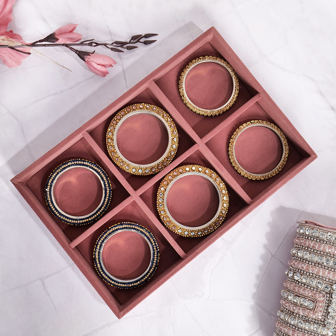 Dark pink velvet tray with 6 slots for bangles, cuffs, and bracelets.