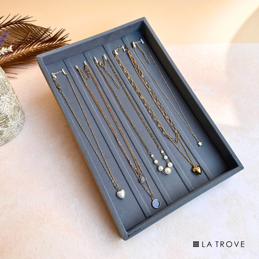 Grey necklace jewellery tray with soft lining for tangle-free storage.