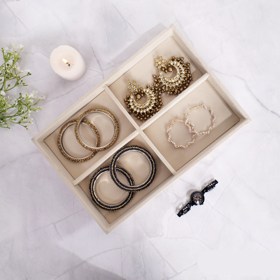 Cream velvet jewellery tray with 4 sections for rings and accessories.