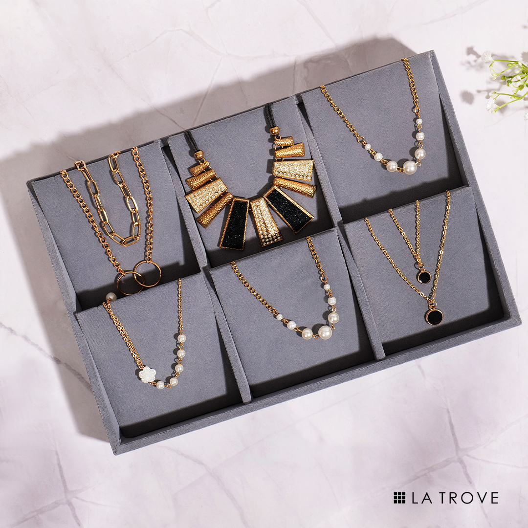 Grey jewellery tray for storing and organizing necklaces tangle-free.