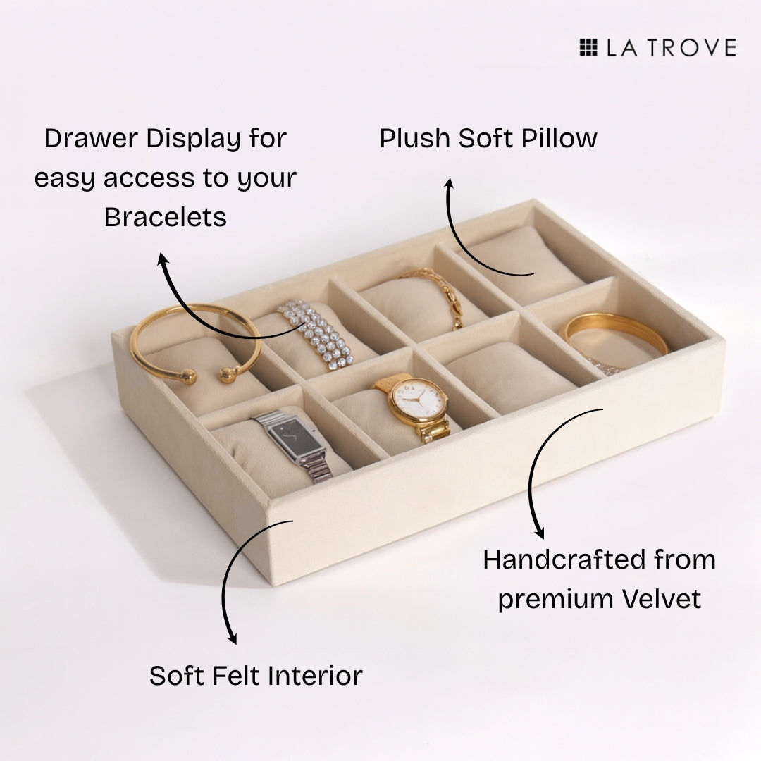 luxury cream jewelry storage tray with eight compartments.