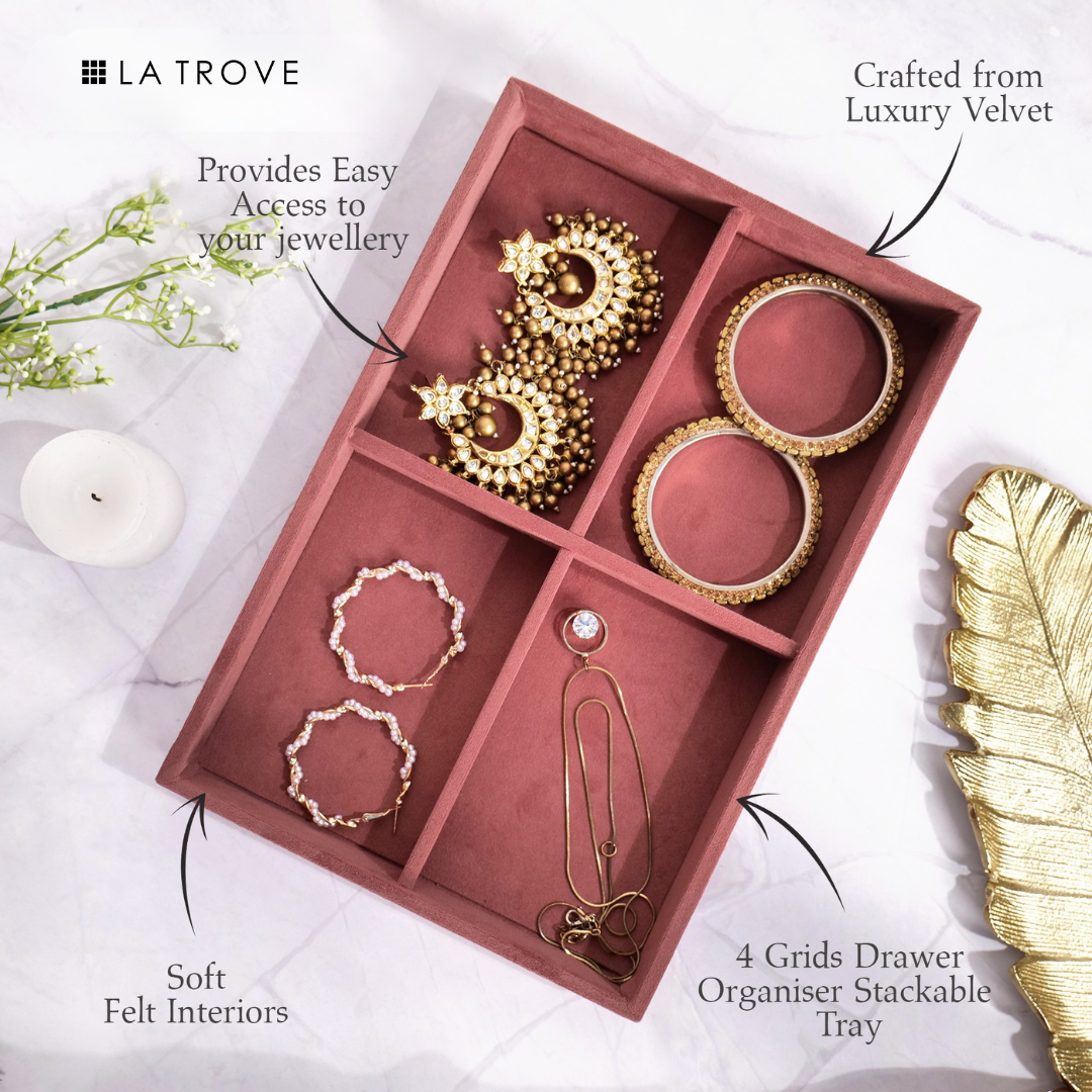 Dark pink velvet tray with 4 compartments for small jewellery items.