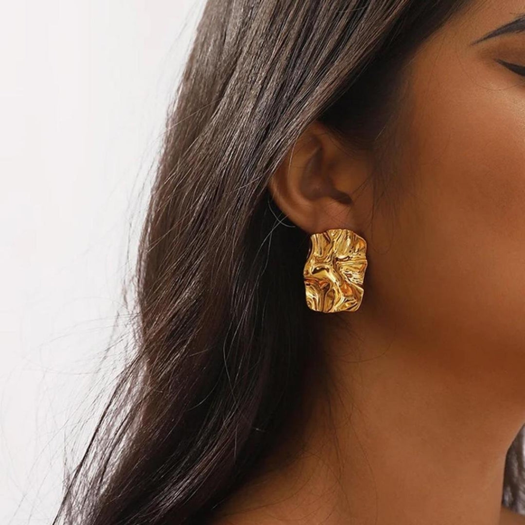 Luxury gold statement earrings for women.