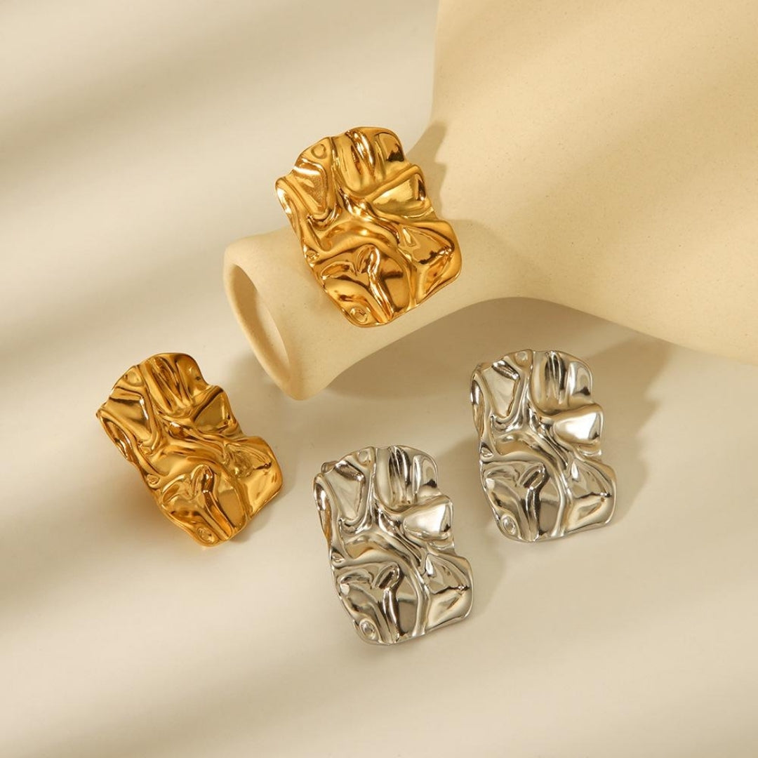 Bold sculpted textured earrings with polished gold finish.