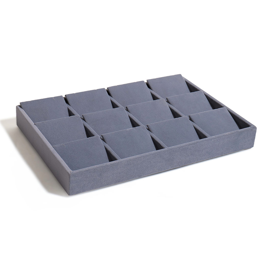 Grey display jewellery tray with soft lining for rings and studs.