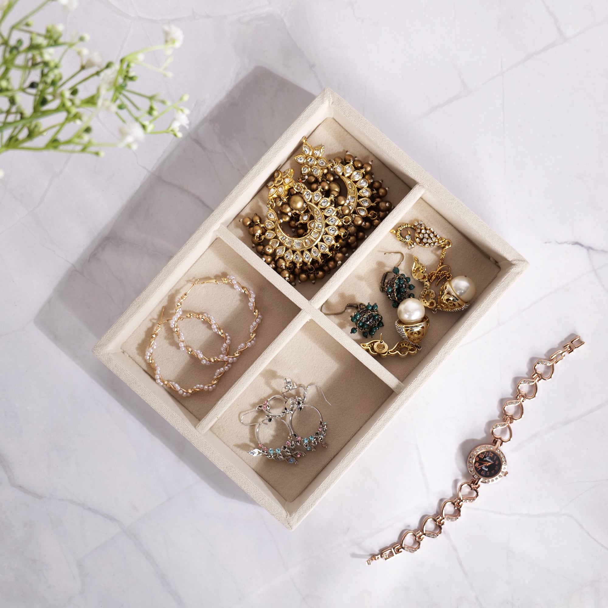 Cream 4-grid jewellery tray with velvet lining for accessories.