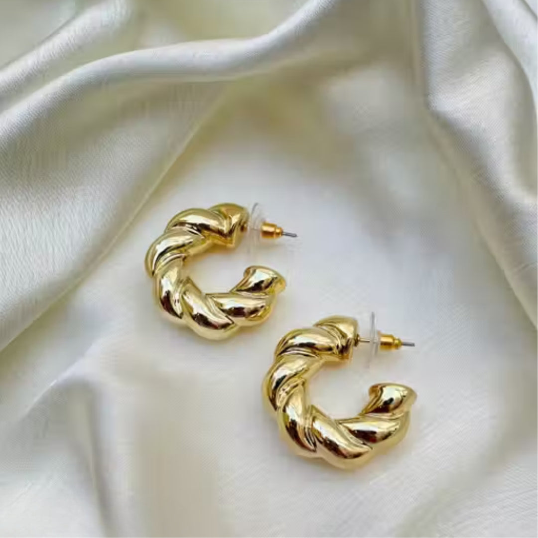Lightweight rope-inspired gold hoop earrings close-up.