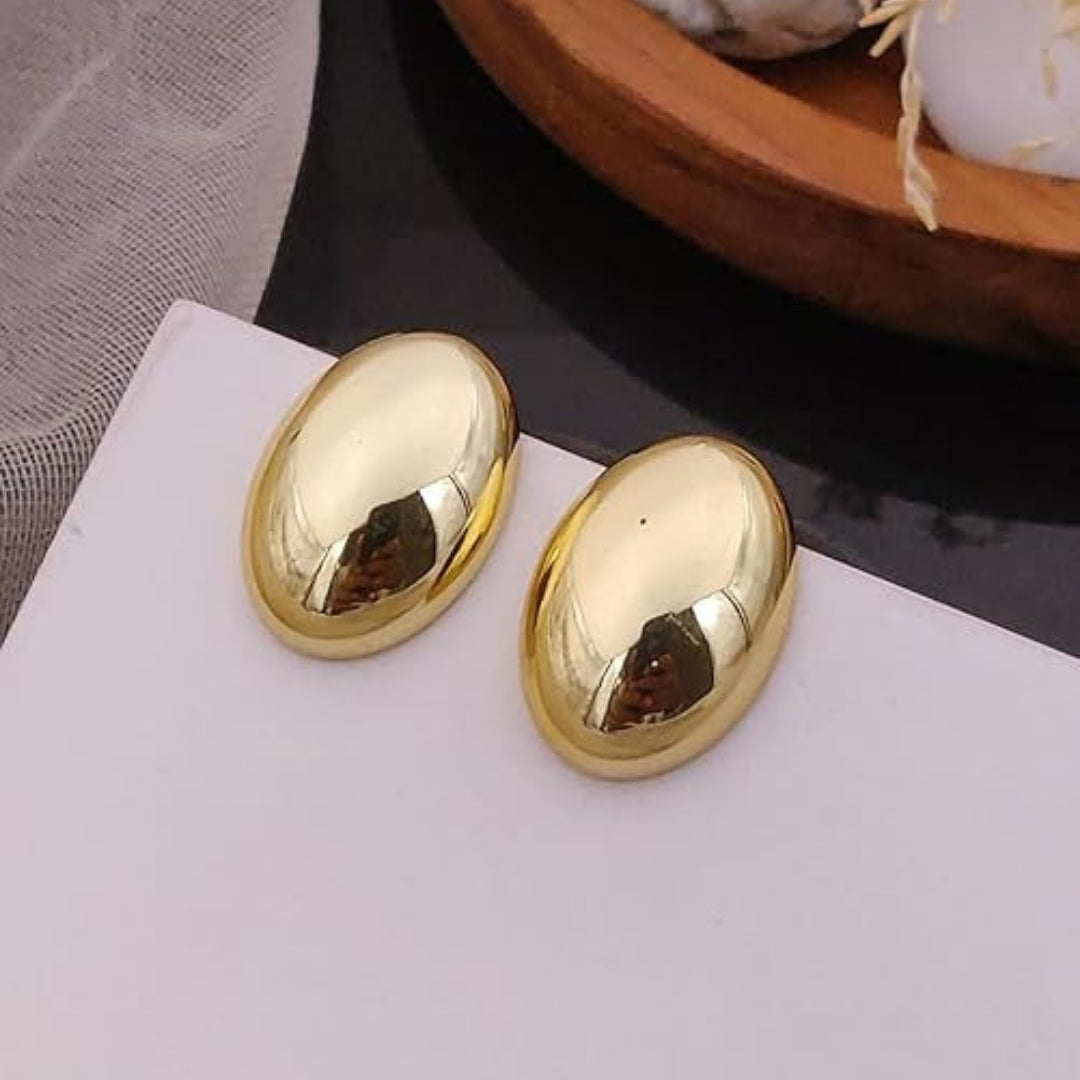 Classic oval gold stud earrings by La Trove.